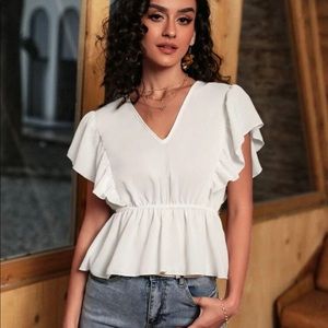 White ruffle blouse